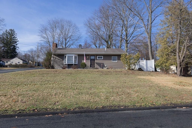 single story home featuring a front yard