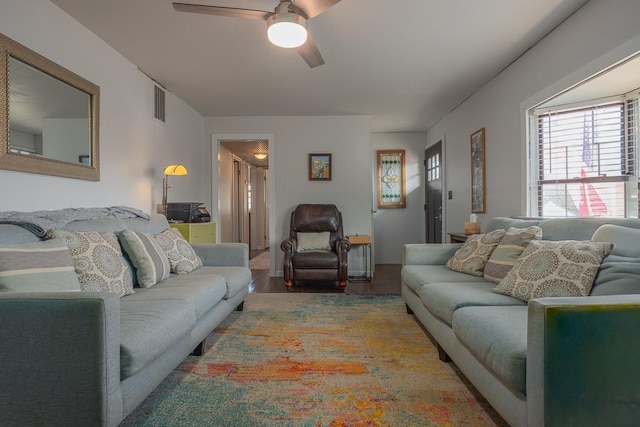 living room with hardwood / wood-style flooring and ceiling fan