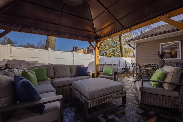 view of patio featuring an outdoor hangout area and a gazebo