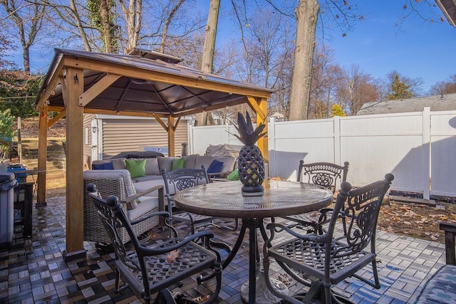 view of patio featuring a gazebo and an outdoor hangout area