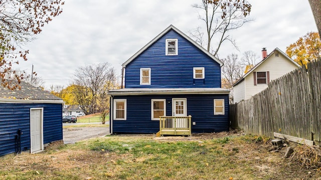 rear view of house with a yard