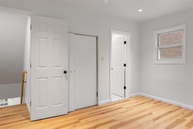 unfurnished bedroom featuring hardwood / wood-style flooring