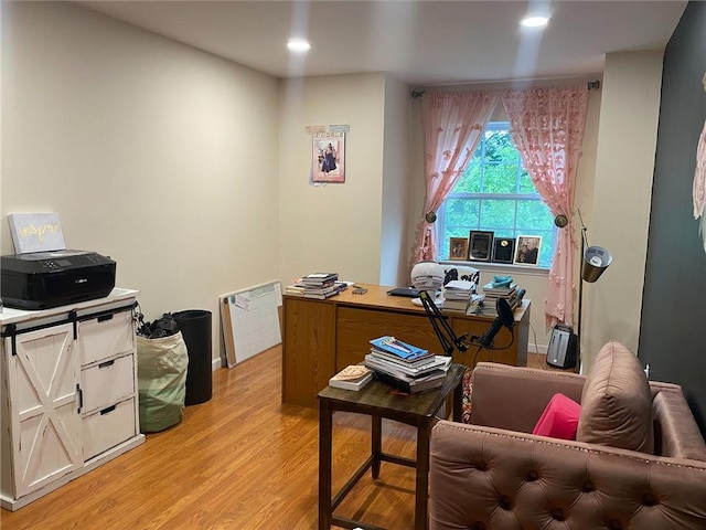 office with light hardwood / wood-style flooring