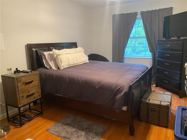 bedroom with light hardwood / wood-style flooring