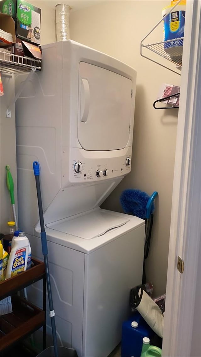 laundry area with stacked washer and dryer