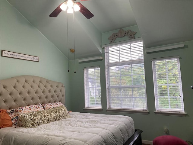 bedroom featuring ceiling fan and vaulted ceiling