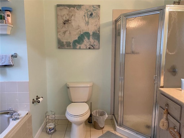 full bathroom with tile patterned flooring, shower with separate bathtub, vanity, and toilet