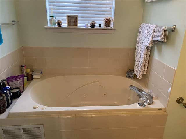 bathroom with tiled tub