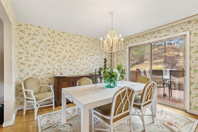 dining area with wallpapered walls, light wood-type flooring, and baseboards