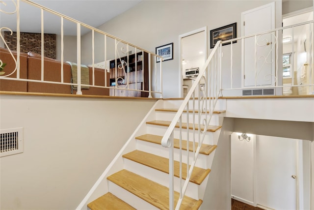 staircase featuring visible vents