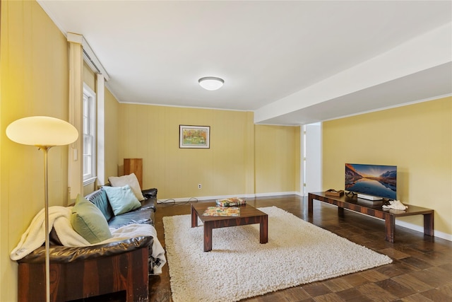 living area with baseboards and wood finished floors