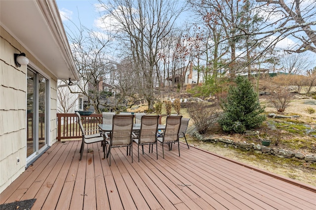 wooden deck featuring outdoor dining area