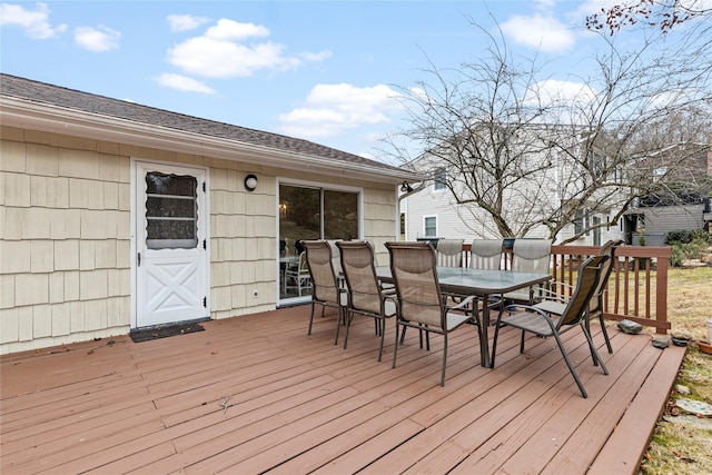 deck with outdoor dining area