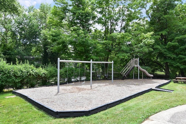 community jungle gym with a lawn