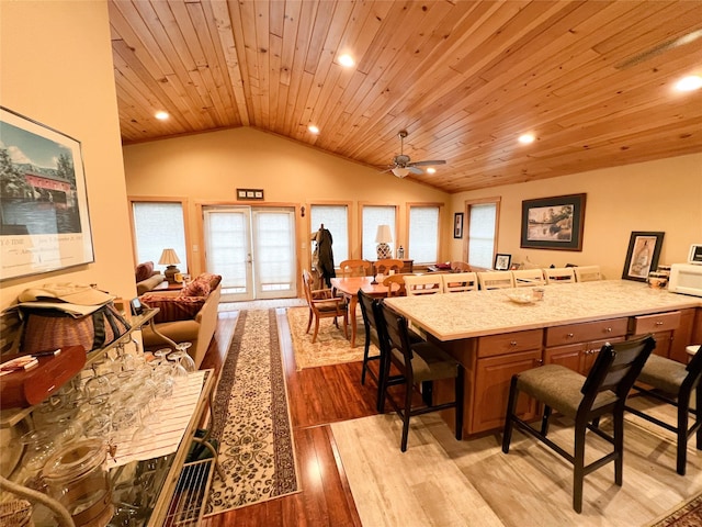 kitchen with french doors, ceiling fan, light hardwood / wood-style flooring, wooden ceiling, and lofted ceiling