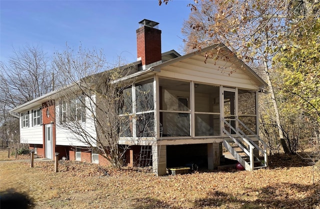 back of house with a sunroom