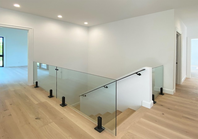 stairway featuring wood-type flooring