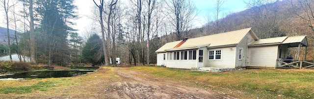 view of side of home featuring a yard