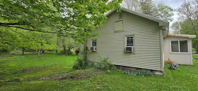 71 Peekamoose Rd, Sundown, NY 12740 - view of side of home featuring a lawn and cooling unit