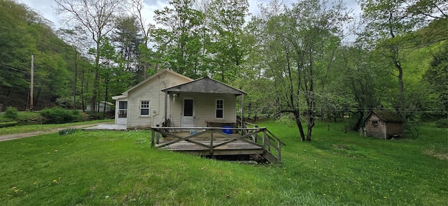 71 Peekamoose Rd, Sundown, NY 12740 - rear view of house with a yard, an outbuilding, and a storage shed