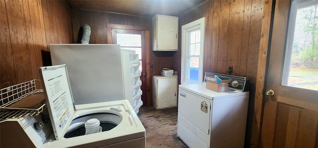 71 Peekamoose Rd, Sundown, NY 12740 - laundry room featuring wood walls, healthy amount of natural light, and separate washer and dryer