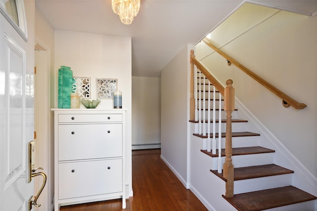 stairs featuring hardwood / wood-style flooring and a baseboard radiator