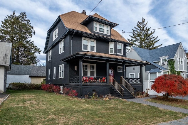 view of front of property featuring a porch and a front lawn