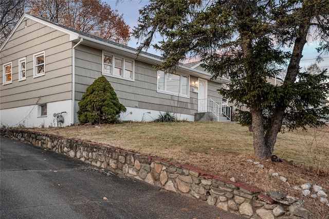 view of home's exterior with a yard