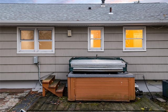 view of patio / terrace featuring a wooden deck and a hot tub