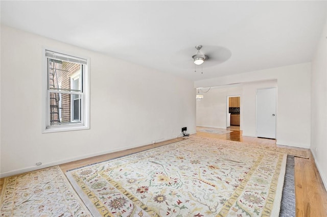 spare room featuring ceiling fan and hardwood / wood-style floors