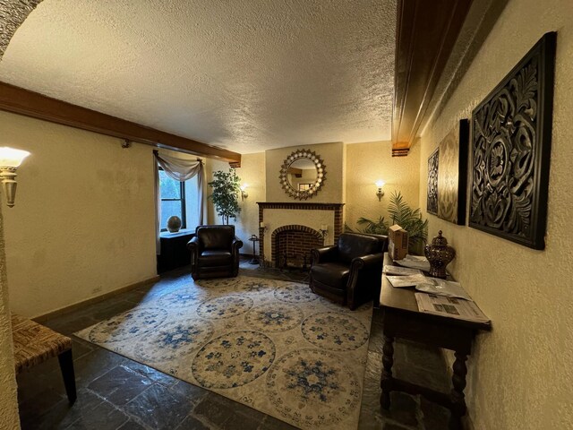 42 Pondfield Rd W Unit 6C, Bronxville, NY 10708 - living area with a textured ceiling, stone tile flooring, a fireplace, and a textured wall