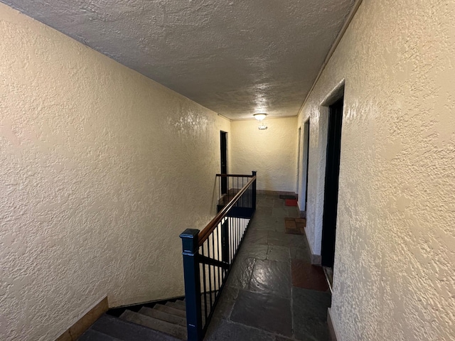 corridor with a textured ceiling