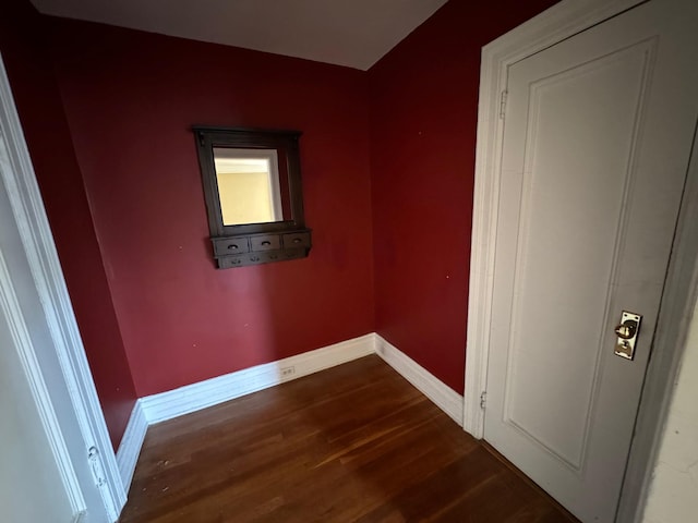 empty room with dark wood-type flooring