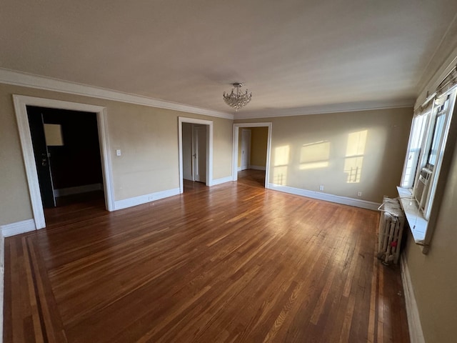 interior space with a chandelier, dark hardwood / wood-style flooring, and ornamental molding