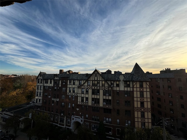 view of outdoor building at dusk