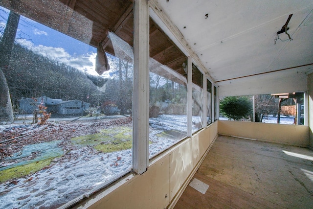 unfurnished sunroom featuring a wealth of natural light