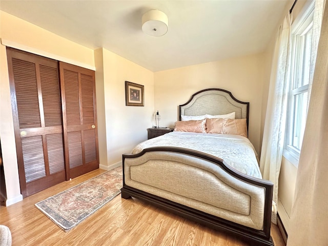 bedroom featuring a closet and wood-type flooring