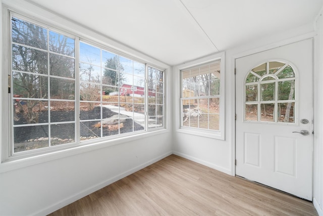 unfurnished sunroom with a healthy amount of sunlight