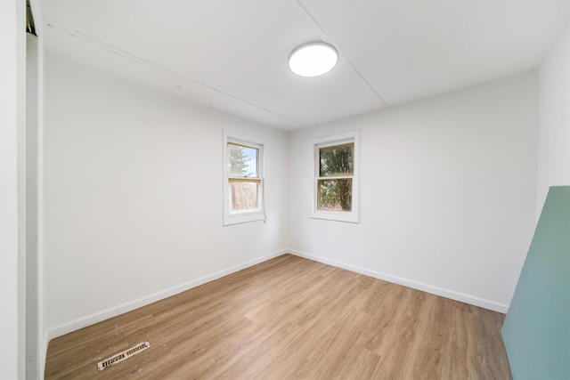 unfurnished room with light hardwood / wood-style floors