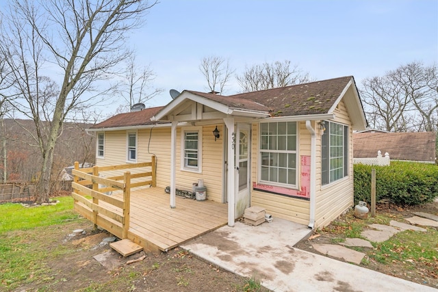 view of front of home featuring a wooden deck