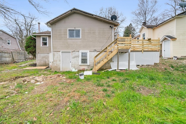 back of house featuring a deck