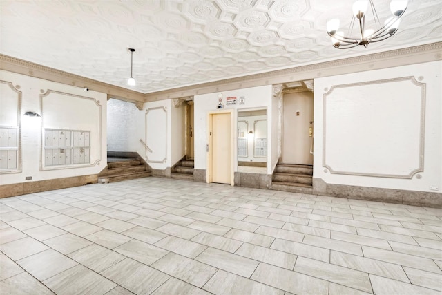 interior space featuring crown molding, a mail area, and a notable chandelier