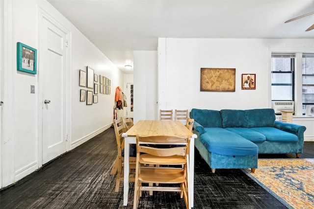 dining room featuring ceiling fan and dark hardwood / wood-style flooring