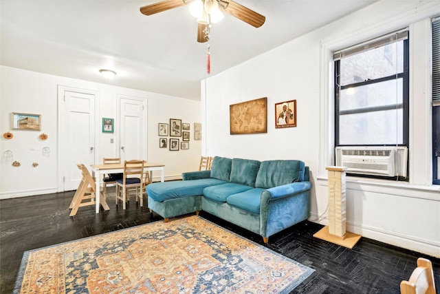 living room with ceiling fan and dark parquet flooring