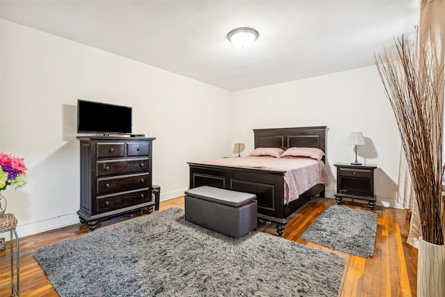 bedroom featuring dark wood-type flooring