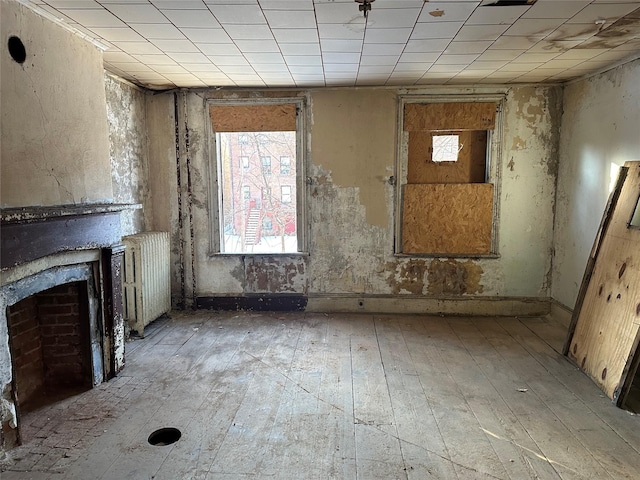 misc room featuring radiator heating unit and light wood-type flooring