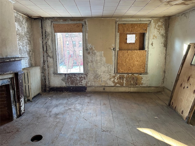 misc room with radiator and light wood-type flooring