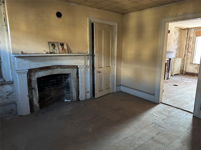 unfurnished living room with a fireplace and hardwood / wood-style floors