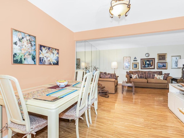 dining space with light hardwood / wood-style flooring