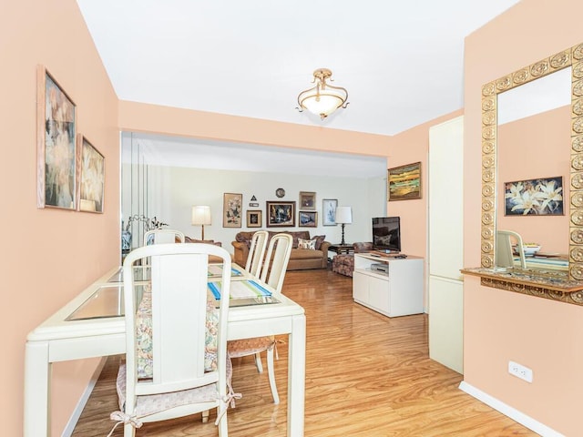 dining area with light wood-type flooring